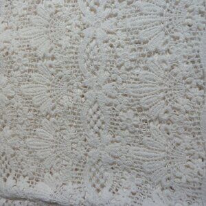Off-white lace fabric with borders on both widths
